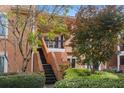 Townhome with brick staircase and lush landscaping at 5356 Brooke Ridge Dr, Dunwoody, GA 30338