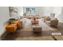 Virtually staged living room with beige furniture and rug at 5876 Poplin Ct, Lithonia, GA 30058