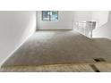Empty living room with neutral gray carpeting at 5876 Poplin Ct, Lithonia, GA 30058