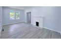 Living room with fireplace and light grey flooring at 535 Lake Dr, Hapeville, GA 30354