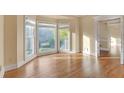Bright living room with hardwood floors, bay window, and access to other rooms at 2545 Winthrope Way, Lawrenceville, GA 30044