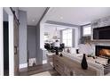 Open living room showcasing a cozy fireplace and stylish furnishings at 301 Retreat Way, Carrollton, GA 30116