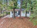 Front view of a white brick ranch house with a dark gray door at 2804 Dearwood Sw Dr, Atlanta, GA 30315