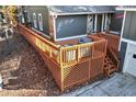 Spacious wooden deck with lattice panels, offering ample outdoor entertaining space at 9154 Branch Valley Way, Roswell, GA 30076