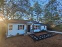 White house with stone walkway, well-maintained lawn at 1093 Oakland Dr, Atlanta, GA 30310