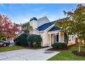 Charming townhome with well-manicured landscaping and driveway at 6315 Wellington Walk Way, Lithonia, GA 30058