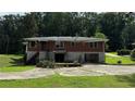 Back of brick ranch house with stone foundation at 539 Lynhurst Sw Dr, Atlanta, GA 30311
