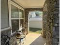 Stone front porch with view of backyard at 2820 Brookford Sw Ln, Atlanta, GA 30331