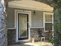 Home's entrance with a decorative glass door at 2820 Brookford Sw Ln, Atlanta, GA 30331