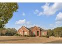 Brick home with landscaped yard and inviting front porch at 620 Springview Dr, Covington, GA 30014