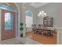 Formal dining room with hardwood floors, chandelier, and large windows at 620 Springview Dr, Covington, GA 30014