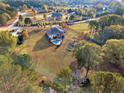 Aerial view of home, pool, and expansive lot at 620 Springview Dr, Covington, GA 30014