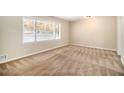 Spacious bedroom with neutral walls and brown carpeting at 4257 Midway Rd, Douglasville, GA 30134