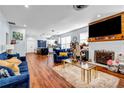 Open living room with fireplace and hardwood floors at 3220 Dogwood Dr, Hapeville, GA 30354