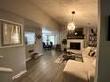 Spacious living room with a sectional sofa and a fireplace at 5343 Highway 5, Douglasville, GA 30135