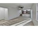 Bright living room featuring hardwood floors and a view of the kitchen at 2887 Hickory Ln, Snellville, GA 30078