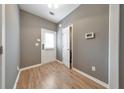 Light-filled foyer with wood-look flooring and neutral walls at 247 Kigian Trl, Woodstock, GA 30188