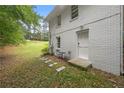 Small patio with sitting area adjacent to house at 6650 Queen Mill Se Rd, Mableton, GA 30126