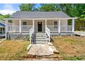 Charming house with front porch and stone steps at 2635 Williams Grant Reynolds Dr, Lithonia, GA 30058