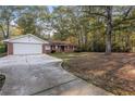 Brick ranch home with a carport and spacious yard at 2273 Hampton Locust Grove Rd, Locust Grove, GA 30248