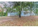 Side view of the house showcasing the backyard at 2229 Whites Mill Rd, Decatur, GA 30032