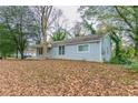 Back view of the house with tree coverage at 2229 Whites Mill Rd, Decatur, GA 30032