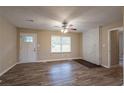 Bright living room with hardwood floors, fireplace, and ceiling fan at 1496 E Highpoint Dr, Douglasville, GA 30134