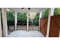 Covered patio with privacy fence and access gate at 3907 Knox Park Ovlk, Duluth, GA 30097