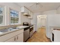 Kitchen with stainless steel appliances and light-colored cabinetry at 6746 Old Beulah Rd, Lithia Springs, GA 30122