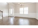 Bright dining room with hardwood floors and chandelier at 7843 Shertall St, Fairburn, GA 30213