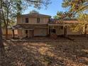 Rear view of house showcasing a patio and surrounding yard at 3142 Pheasant Dr, Decatur, GA 30034