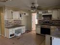 Kitchen needing renovation, featuring granite countertops and stainless steel appliances at 3142 Pheasant Dr, Decatur, GA 30034