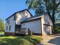 House exterior showcasing a detached garage and wooden deck at 1812 Lakewood Se Ave, Atlanta, GA 30315