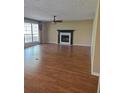 Spacious living room featuring hardwood floors and a fireplace at 2055 Springer Walk, Lawrenceville, GA 30043