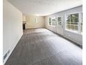 Spacious living room with large windows and gray carpet at 4405 Cary Dr, Snellville, GA 30039