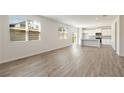 Open living space with hardwood floors and access to the kitchen and backyard at 4171 Viola Pl, Atlanta, GA 30349