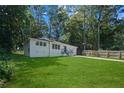 Spacious backyard with lush greenery and a fenced perimeter at 2281 Nelms Sw Dr, Atlanta, GA 30315