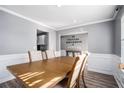 Bright dining room with hardwood floors and a wood table at 6634 Pine Valley Trce, Stone Mountain, GA 30087