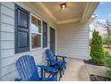 Inviting front porch with blue Adirondack chairs at 3530 Ridge Hill Pkwy, Douglasville, GA 30135