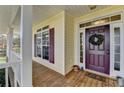 Inviting front porch with a charming door and a view of the backyard at 3830 Martin Farm Rd, Suwanee, GA 30024