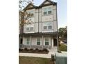 Three-story townhouse with gray siding and a front porch at 2112 Remy Ct # 47A, Kennesaw, GA 30144
