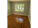 Bright bedroom with hardwood floors and large windows at 5621 Zanola Sw Dr, Mableton, GA 30126