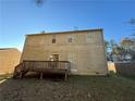 Back of house showing a deck and fenced yard at 5750 Old Carriage Dr, Atlanta, GA 30349