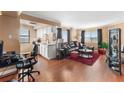 Open living area with leather sectional sofa and hardwood floors at 795 Hammond Dr # 808, Atlanta, GA 30328