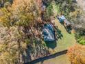 Aerial view of the house and surrounding property, showcasing a large backyard at 51 Jennifer Ln, Rydal, GA 30171