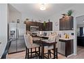 Modern kitchen with stainless steel appliances and dark wood cabinetry at 3628 Walnut Creek Way, Lithonia, GA 30038