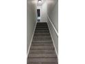 Carpeted staircase leading to upper level at 120 Biscayne Nw Dr # C9, Atlanta, GA 30309