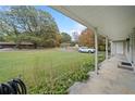 View from the front porch overlooking the yard at 1874 Old Lost Mountain Rd, Powder Springs, GA 30127