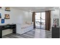 Bedroom with daybed, desk, and access to balcony at 1280 W Peachtree Nw St # 914, Atlanta, GA 30309