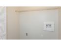 Laundry closet with shelving and hookups for washer/dryer at 894 Churchill Ct, Stone Mountain, GA 30083